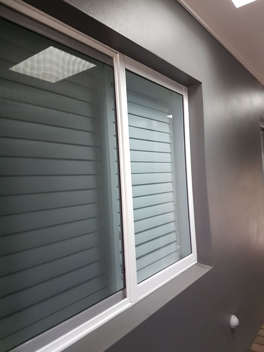 Exterior window with clear glass and clean white frames